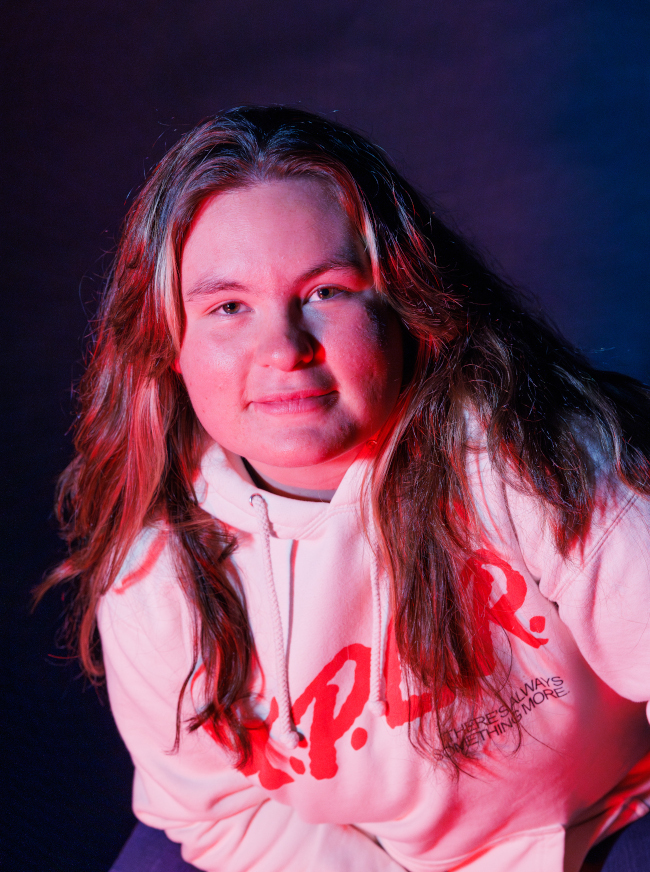 Katelyn portrait with a blue/purplish background